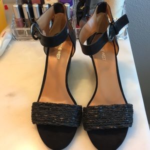 Black wedge open toe sandals with ankle strap.